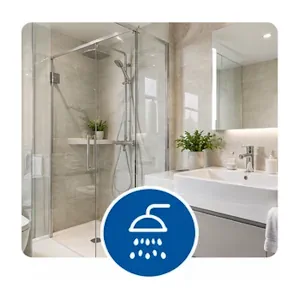 Salle de bains moderne avec douche vitrée et lavabo après nettoyage